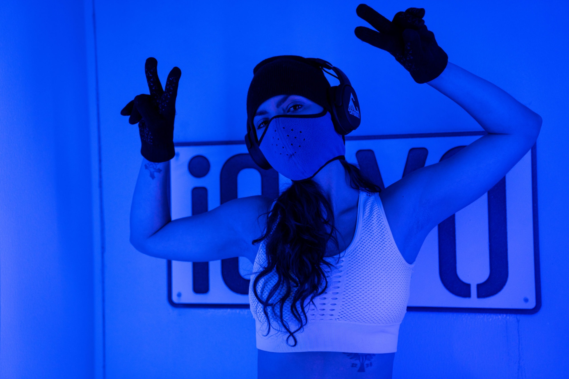 Guest standing inside the °CRYO Built whole-body cryotherapy chamber at iCRYO Boca Raton